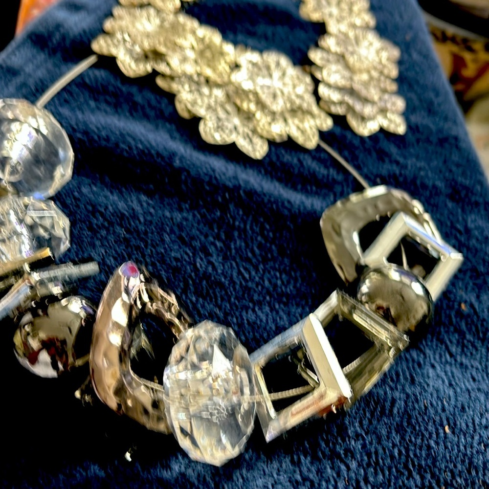 2 necklaces, both silver, costume jewelry